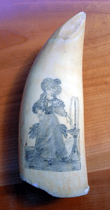 Antique scrimshaw tooth with fashion lady