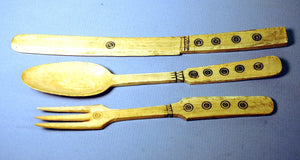 A set of three carved bone serving set
