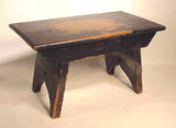 Antique American footstool with "bootjack" ends