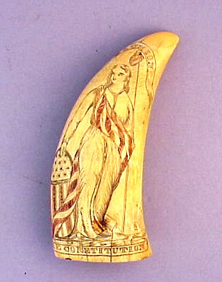 Antique American scrimshaw tooth with figure of Liberty.