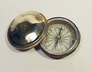 Antique covered brass pocket compass.