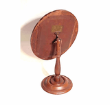 Antique oval toilet mirror on adjustable stand.