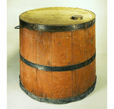 Antique red painted kerosene keg with spigot