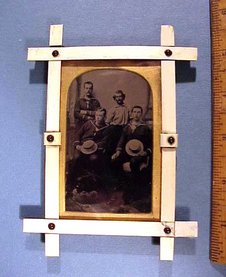 Antique scrimshaw frame with tin type
