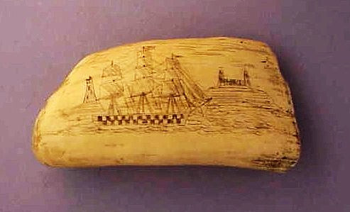 Antique scrimshaw tooth with ship and lighthouse