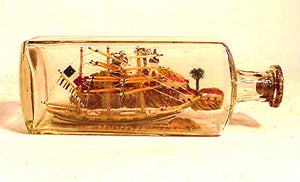 Antique ship in bottle flying the French flag