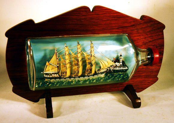 Vintage three-masted ship in bottle 