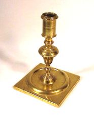 18th C. Brass candlestick with square base.