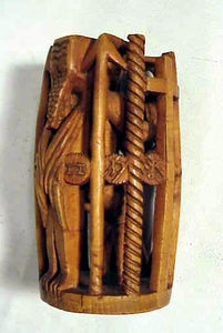 A folk art wooden carving - Man in a Cage of Life.