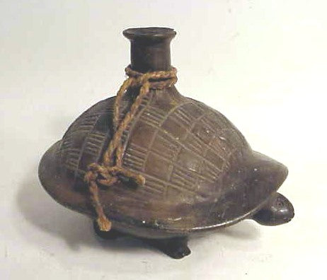 A pottery bottle in the form of a turtle