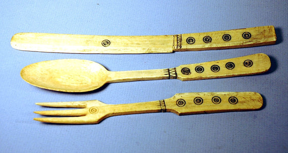 A set of three carved bone serving set