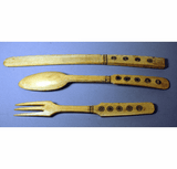 A set of three carved bone serving set