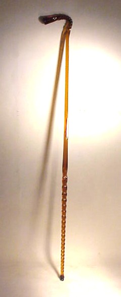 Antique amber color glass whimsey cane