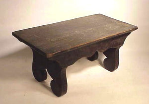 Antique American footstool with shaped sides.
