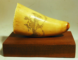 Antique American scrimshaw tooth on stand