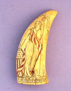 Antique American scrimshaw tooth with figure of Liberty.