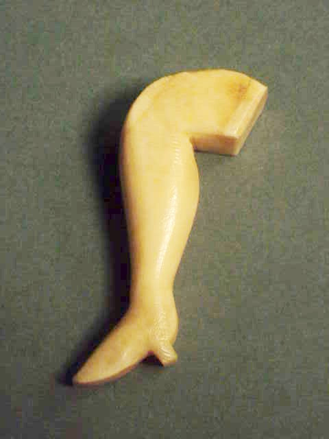Antique American scrimshaw whale ivory lady's leg.