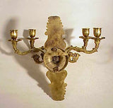 Antique brass wall arm with five branches.