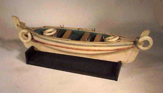 Antique carved wooden life boat.