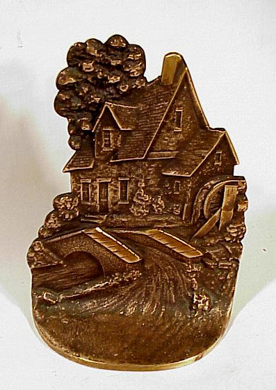 Antique cast brass COTTAGE doorstop.