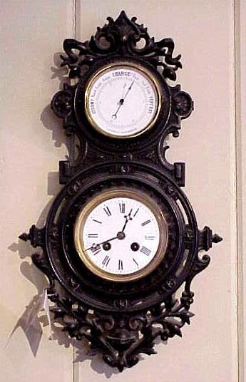 Antique cast iron wall barometer and clock