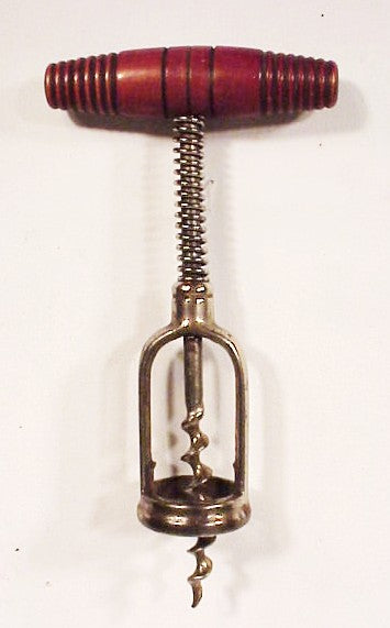 Antique corkscrew with spring on stem,
