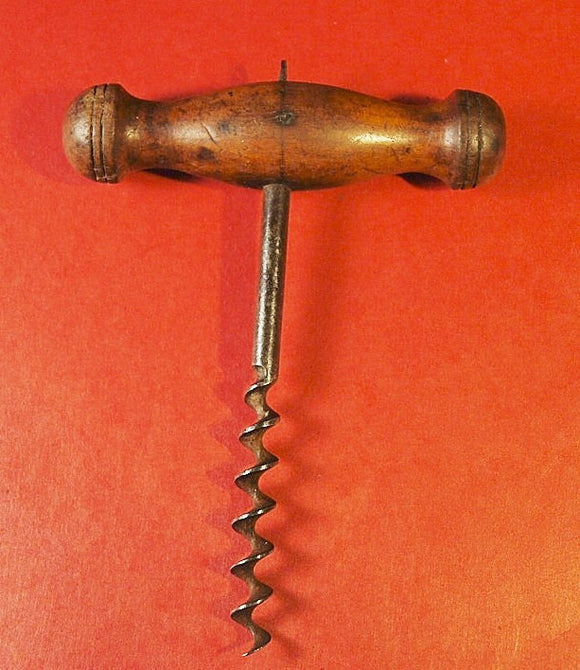 Antique corkscrew with turned wooden handle