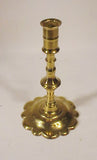 Antique English brass candlestick with petal base.