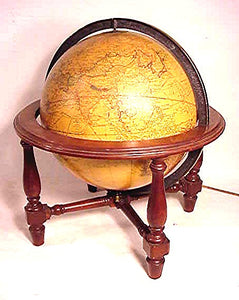Antique globe on stand that lights.