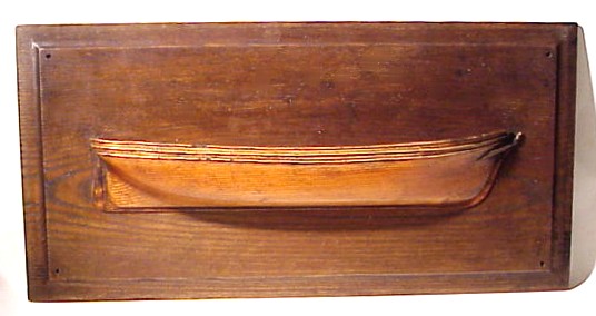 Antique half-model of ship with figurehead.