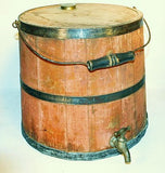 Antique red painted kerosene keg with spigot