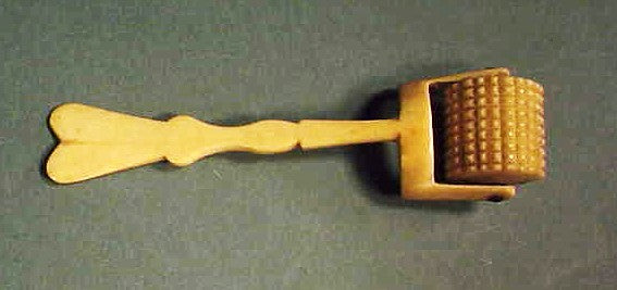 Antique scrimshaw bone pastry roller.