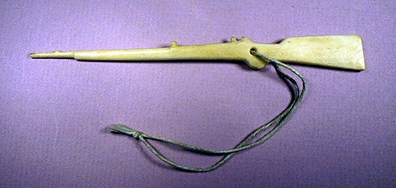Antique scrimshaw bone toy rifle