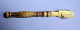 Antique scrimshaw pie crimper with wooden handle