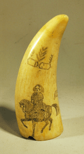 Antique scrimshaw sperm whale's tooth with horse rider