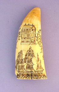 Antique scrimshaw tooth with ships and churches