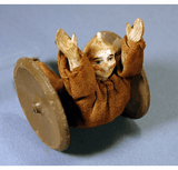 Antique toy clown rolling wheel toy