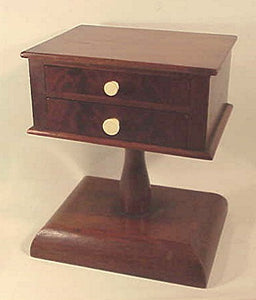 Antique two-drawer sewing stand.