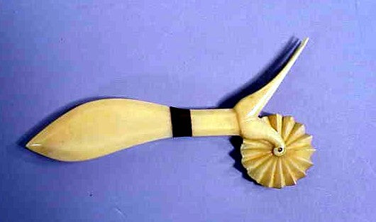 Antique whale ivory pie crimper with three tyne fork.