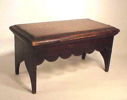 Antique wooden stool with scallop skirt
