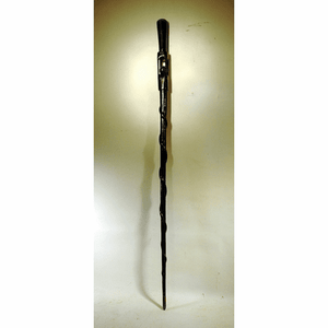 Handsome black painted folk carved cane