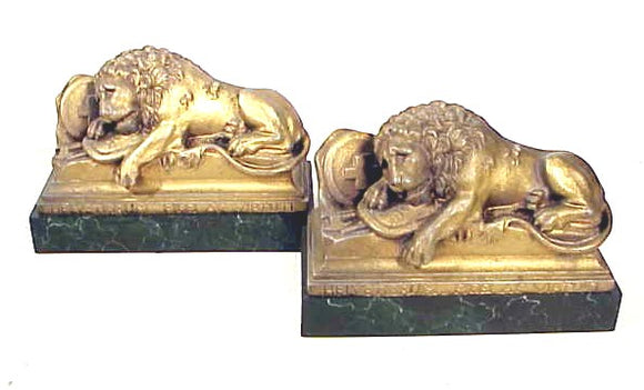 Pair antique cast lion bookends mounted on marble bases.