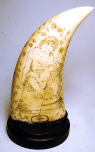 Pair antique scrimshaw sperm whale's teeth young children and Dogs