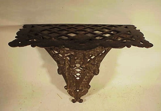 Rare antique American cast-iron wall shelf