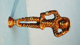 Rare antique brass HARLEQUIN pipe tamper