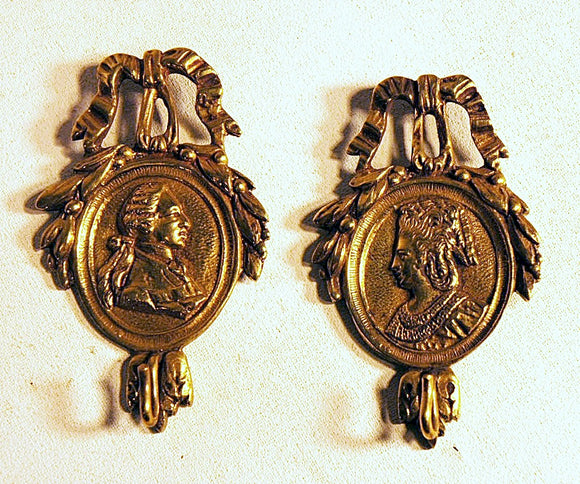 Rare pair of antique cast brass picture hangers