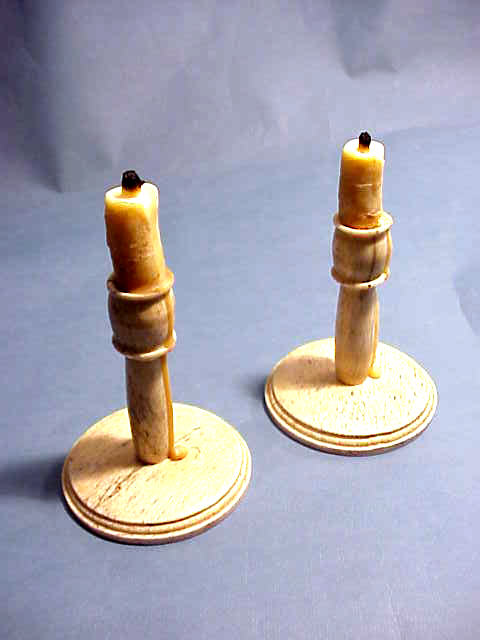 Rare pair of antique scrimshaw whalebone candlesticks