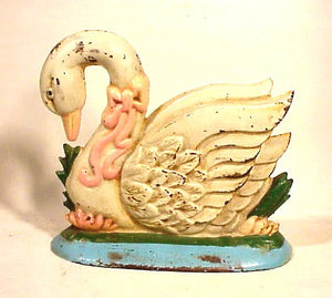 Vintage cast iron SWAN doorstop in original paint