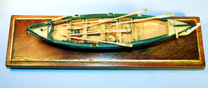 Vintage miniature whaleboat model on stand