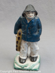Vintage Old Salt Doorstop with Blue Coat
